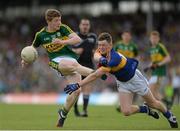 5 July 2015; Brian ó Seanacháin, Kerry, in action against Alan Tynan, Tipperary. Electric Ireland Munster GAA Football Minor Championship Final, Kerry v Tipperary. Fitzgerald Stadium, Killarney, Co. Kerry. Picture credit: Eoin Noonan / SPORTSFILE