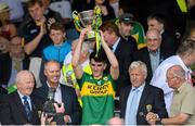 5 July 2015; Mark O'Connor, Kerry, Lifting the cup after his side won the Munster final. Electric Ireland Munster GAA Football Minor Championship Final, Kerry v Tipperary. Fitzgerald Stadium, Killarney, Co. Kerry. Picture credit: Eoin Noonan / SPORTSFILE