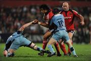 20 September 2008; Doug Howlett, Munster, is tackled by Paul Tito, left, and Ceri Sweeney, Cardiff Blues. Magners League, Munster v Cardiff Blues, Musgrave Park, Cork. Picture credit: Stephen McCarthy / SPORTSFILE
