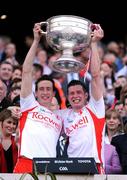 21 September 2008; Tyrone players Colm, left, and Sean Cavanagh lift the Sam Maguire Cup after victory over Kerry. GAA Football All-Ireland Senior Championship Final, Kerry v Tyrone, Croke Park, Dublin. Picture credit: Brendan Moran / SPORTSFILE