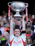 21 September 2008; Tyrone's Enda McGinley lifts the Sam Maguire Cup after victory over Kerry. GAA Football All-Ireland Senior Championship Final, Kerry v Tyrone, Croke Park, Dublin. Picture credit: Brendan Moran / SPORTSFILE
