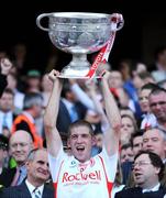 21 September 2008; Tyrone's Kevin Hughes lifts the Sam Maguire Cup after victory over Kerry. GAA Football All-Ireland Senior Championship Final, Kerry v Tyrone, Croke Park, Dublin. Picture credit: Brendan Moran / SPORTSFILE