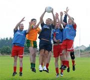 27 September 2008; Stars show off razor sharp skills: GAA stars Sean Og O hAilpin and Jason Sherlock today pulled on their Gillette jerseys as they hosted the 2008 Gillette Fusion GAA Coaching Clinic at St Brigids GAA club in Dublin. The Clinic saw 80 lucky participants gather from all parts of the country to take part in an exclusive days’ coaching with the former All-Ireland winners and top GAA coaches. Dublin footballer Jason Sherlock wins possession ahead of participants of the 2008 Gillette Fusion GAA Coaching Clinic. To see all the actions and top tips log on to www.gillettechampions.ie. St Brigid's GAA Club, Navan Road, Blanchardstown, Dublin. Picture credit: Pat Murphy / SPORTSFILE