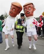 27 September 2008; Garda Karen Grogan &quot;arrests&quot; Cul Green Campaigners at the ESB GAA Football All-Ireland Minor Championship Final Replay, Tyrone v Mayo, Pearse Park, Longford. Picture credit: Oliver McVeigh / SPORTSFILE