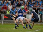4 July 2015; Tommy Fitzgerald, Laois, in action against Niall Corcoran, left, and Gary Maguire, Dublin. GAA Hurling All-Ireland Senior Championship, Round 1, Laois v Dublin. O'Moore Park, Portlaoise, Co. Laois. Picture credit: Dáire Brennan / SPORTSFILE