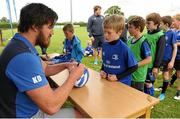 8 July 2015; Kane Douglas and Mick Kearney of Leinster Rugby came out to the Bank of Ireland Summer Camp to meet up with some local young rugby talent in Kilkenny RFC. Pictured is Kane Douglas signing a rugby ball for one of the participants of the Bank of Ireland Summer Camp. Kilkenny RFC, Kilkenny. Picture credit: Seb Daly / SPORTSFILE