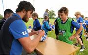 8 July 2015; Kane Douglas and Mick Kearney of Leinster Rugby came out to the Bank of Ireland Summer Camp to meet up with some local young rugby talent in Kilkenny RFC. Pictured is Kane Douglas signing a rugby ball for one of the participants of the Bank of Ireland Summer Camp. Kilkenny RFC, Kilkenny. Picture credit: Seb Daly / SPORTSFILE