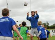 8 July 2015; Kane Douglas and Mick Kearney of Leinster Rugby came out to the Bank of Ireland Summer Camp to meet up with some local young rugby talent in Kilkenny RFC. Pictured is Kane Douglas with participants during the Bank of Ireland Summer Camp. Kilkenny RFC, Kilkenny. Picture credit: Seb Daly / SPORTSFILE