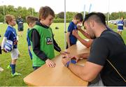 8 July 2015; Kane Douglas and Mick Kearney of Leinster Rugby came out to the Bank of Ireland Summer Camp to meet up with some local young rugby talent in Kilkenny RFC. Pictured is Mick Kearney signing an autograph for one of the participants of the Bank of Ireland Summer Camp. Kilkenny RFC, Kilkenny. Picture credit: Seb Daly / SPORTSFILE