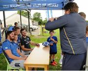 8 July 2015; Kane Douglas and Mick Kearney of Leinster Rugby came out to the Bank of Ireland Summer Camp to meet up with some local young rugby talent in Kilkenny RFC. Pictured are Kane Douglas and Mick Kearney posing for photos with participants of the Bank of Ireland Summer Camp. Kilkenny RFC, Kilkenny. Picture credit: Seb Daly / SPORTSFILE