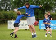 8 July 2015; Kane Douglas and Mick Kearney of Leinster Rugby came out to the Bank of Ireland Summer Camp to meet up with some local young rugby talent in Kilkenny RFC. Pictured is Mick Kearney as he is tackled by participant James McEvoy. Kilkenny RFC, Kilkenny. Picture credit: Seb Daly / SPORTSFILE