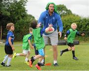 8 July 2015; Kane Douglas and Mick Kearney of Leinster Rugby came out to the Bank of Ireland Summer Camp to meet up with some local young rugby talent in Kilkenny RFC. Pictured is Kane Douglas with participants taking part in one of the group activities. Kilkenny RFC, Kilkenny. Picture credit: Seb Daly / SPORTSFILE