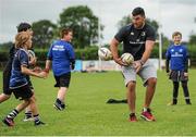 8 July 2015; Kane Douglas and Mick Kearney of Leinster Rugby came out to the Bank of Ireland Summer Camp to meet up with some local young rugby talent in Kilkenny RFC. Pictured is Mick Kearney with participants during the summer camp. Kilkenny RFC, Kilkenny. Picture credit: Seb Daly / SPORTSFILE