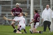 28 September 2008; Frances McAuley, Cushendalls Ruairi Og's, saves a penalty by Liam Watson, Loughgiel Shamrocks, assisted by Aaron Graffin and Aidan Delargy.  Antrim County Senior Hurling Final, Cushendalls Ruairi Og's v Loughgiel Shamrocks, Casement Park, Belfast, Co. Antrim. Picture credit: Oliver McVeigh / SPORTSFILE