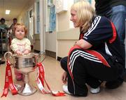 29 September 2008; Cork's Elaine Harte with 14 month old Kelly Barker, from Meath, and the Brendan Martin Cup during a visit to Our Lady's Hospital for Sick Chidren in Crumlin. Crumlin, Co. Dublin. Picture credit: Pat Murphy / SPORTSFILE