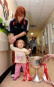 29 September 2008; Cork's Deirdre O'Reilly with 14 month old Kelly Barker, from Meath, and the Brendan Martin Cup during a visit to Our Lady's Hospital for Sick Chidren in Crumlin. Crumlin, Co. Dublin. Picture credit: Pat Murphy / SPORTSFILE