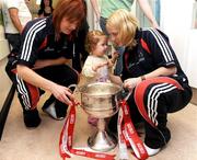 29 September 2008; Cork's Deirdre O'Reilly, left, and Elaine Harte with 14 month old Kelly Barker, from Meath, and the Brendan Martin Cup during a visit to Our Lady's Hospital for Sick Chidren in Crumlin. Crumlin, Co. Dublin. Picture credit: Pat Murphy / SPORTSFILE