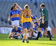 28 September 2008; A dejected Grace Lynch, Clare, as Tipperary players celebrate at the end of the game. TG4 All-Ireland Ladies Intermediate Football Championship Final, Clare v Tipperary, Croke Park, Dublin. Picture credit: David Maher / SPORTSFILE