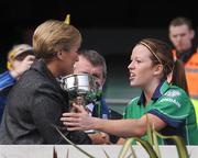 28 September 2008; London captain Sinead Daly is presented with the trophy by Geraldine Giles, President, Cumann Peil Gael na mBan. TG4 All-Ireland Ladies Junior Football Championship Final, Derry v London, Croke Park, Dublin. Picture credit: Brendan Moran / SPORTSFILE
