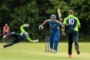 10 July 2015; Gerry Snyman, Namibia, hits the bowl of John Mooney, Ireland, to be caught by wicket keeper Gary Wilson. ICC World Twenty20 Qualifier 2015, Ireland v Namibia. Stormont, Belfast. Picture credit: Oliver McVeigh / ICC / SPORTSFILE