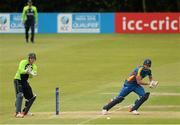 10 July 2015; JJ Smit, Namibia, hits a run as the Ireland wicketkeeper Gary Wilson keeps a close eye. ICC World Twenty20 Qualifier 2015, Ireland v Namibia. Stormont, Belfast. Picture credit: Oliver McVeigh / ICC / SPORTSFILE