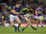 5 July 2015; Conor Geaney, Kerry, in action against Tommy Lowry, Tipperary. Electric Ireland Munster GAA Football Minor Championship Final, Kerry v Tipperary. Fitzgerald Stadium, Killarney, Co. Kerry.  Picture credit: Brendan Moran / SPORTSFILE