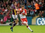 11 July 2015; Fergal Doherty, Derry, in action against Adrian Flynn, Wexford. GAA Football All-Ireland Senior Championship, Round 2B, Derry v Wexford, Owenbeg, Derry. Picture credit: Oliver McVeigh / SPORTSFILE