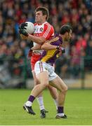 11 July 2015; Mark Lynch, Derry, in action against Graeme Molloy, Wexford. GAA Football All-Ireland Senior Championship, Round 2B, Derry v Wexford, Owenbeg, Derry. Picture credit: Oliver McVeigh / SPORTSFILE