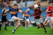 11 July 2015; Ger Mulhair, Tipperary, in action against Pádrig Rath, Louth. GAA Football All-Ireland Senior Championship, Round 2B, Tipperary v Louth, Semple Stadium, Thurles, Co. Tipperary. Picture credit: Eóin Noonan / SPORTSFILE