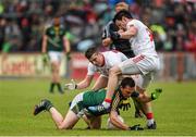 11 July 2015; James McEntee, Meath, in action against Mattie Donnelly, right, and Connor McAliskey, Tyrone. GAA Football All-Ireland Senior Championship, Round 2B, Tyrone v Meath, Healy Park, Omagh, Co. Tyrone. Photo by Sportsfile