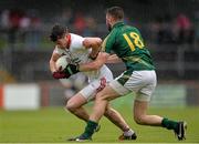 11 July 2015; Richie Donnelly, Tyrone, in action against Michael Newman, Meath. GAA Football All-Ireland Senior Championship, Round 2B, Tyrone v Meath, Healy Park, Omagh, Co. Tyrone. Picture credit: Brendan Moran / SPORTSFILE