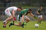 11 July 2015; Michael Newman, Meath, gathers possession ahead of Richie Donnelly, Tyrone. GAA Football All-Ireland Senior Championship, Round 2B, Tyrone v Meath, Healy Park, Omagh, Co. Tyrone. Picture credit: Brendan Moran / SPORTSFILE