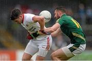 11 July 2015; Michael Newman, Meath, dispossesses Richie Donnelly, Tyrone. GAA Football All-Ireland Senior Championship, Round 2B, Tyrone v Meath, Healy Park, Omagh, Co. Tyrone. Picture credit: Brendan Moran / SPORTSFILE