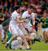 11 July 2015; Barry Tierney, left, and Richie Donnelly, Tyrone, contest a loose ball with Michael Newman, Meath. GAA Football All-Ireland Senior Championship, Round 2B, Tyrone v Meath, Healy Park, Omagh, Co. Tyrone. Picture credit: Brendan Moran / SPORTSFILE