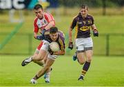 11 July 2015; Eoghan Nolan, Wexford, supported by Adrian Flynn, in action against Eoin Bradley, Derry. GAA Football All-Ireland Senior Championship, Round 2B, Derry v Wexford, Owenbeg, Derry. Picture credit: Oliver McVeigh / SPORTSFILE