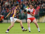 11 July 2015; Mark Lynch, Derry, in action against Graeme Molloy, Wexford. GAA Football All-Ireland Senior Championship, Round 2B, Derry v Wexford, Owenbeg, Derry. Picture credit: Oliver McVeigh / SPORTSFILE