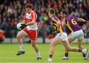 11 July 2015; Mark Lynch, Derry, in action against Kieran Butler and Graeme Molloy, Wexford. GAA Football All-Ireland Senior Championship, Round 2B, Derry v Wexford, Owenbeg, Derry. Picture credit: Oliver McVeigh / SPORTSFILE