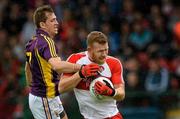 11 July 2015; Fergal Doherty, Derry, in action against Adrian Flynn, Wexford. GAA Football All-Ireland Senior Championship, Round 2B, Derry v Wexford, Owenbeg, Derry. Picture credit: Oliver McVeigh / SPORTSFILE