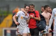 11 July 2015; Ronan McNabb, Tyrone, celebrates with member of the Tyrone backroom staff Dermot McCaughey after the game. GAA Football All-Ireland Senior Championship, Round 2B, Tyrone v Meath, Healy Park, Omagh, Co. Tyrone. Photo by Sportsfile