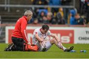 11 July 2015; Colm Cavanagh, Tyrone, is attended to by medical personnel after the final whistle. GAA Football All-Ireland Senior Championship, Round 2B, Tyrone v Meath, Healy Park, Omagh, Co. Tyrone. Picture credit: Brendan Moran / SPORTSFILE