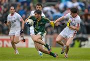 11 July 2015; Donal Keogan, Meath, attempts to get away from Ronan O'Neill, centre and Conall McCann, Tyrone. GAA Football All-Ireland Senior Championship, Round 2B, Tyrone v Meath, Healy Park, Omagh, Co. Tyrone. Picture credit: Brendan Moran / SPORTSFILE