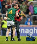 11 July 2015; Donncha Tobin, Meath, is attended to by the Meath team physio in the final moments of the game after an accidental clash with Colm Cavanagh, Tyrone. GAA Football All-Ireland Senior Championship, Round 2B, Tyrone v Meath, Healy Park, Omagh, Co. Tyrone. Picture credit: Brendan Moran / SPORTSFILE