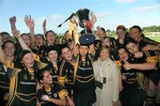 5 October 2008; Kilkenny captain Sinead Brennan and her team-mates celebrate after President of the Camogie Association Liz Howard presents them with the cup. Gala All-Ireland Intermediate Championship Final, Cork v Kilkenny, McDonagh Park, Nenagh, Co.Tipperary. Picture credit: Brian Lawless / SPORTSFILE
