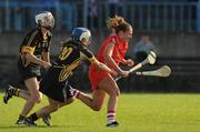 5 October 2008; Regina Curtin, Cork, in action against Michelle Farrell, and Claire Aylward, left, Kilkenny. Gala All-Ireland Intermediate Championship Final, Cork v Kilkenny, McDonagh Park, Nenagh, Co.Tipperary. Picture credit: Brian Lawless / SPORTSFILE