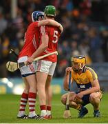 11 July 2015; John Conlon, Clare, watches on as Damien Cahalane, left, and Aidan Walsh, Cork, celebrate their victory. GAA Hurling All-Ireland Senior Championship, Round 2, Clare v Cork. Semple Stadium, Thurles, Co. Tipperary. Picture credit: Stephen McCarthy / SPORTSFILE