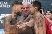 10 July 2015; Cody Garbrandt and Henry Briones face off during the weighs in ahead of the UFC 189 Interim Featherweight Title fight between Conor McGregor and Chad Mendes. MGM Grand Garden Arena, Las Vegas, USA. Picture credit: Esther Lin / SPORTSFILE