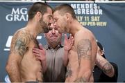 10 July 2015; Matt Brown and Tim Means face off during the weighs in ahead of the UFC 189 Interim Featherweight Title fight between Conor McGregor and Chad Mendes. MGM Grand Garden Arena, Las Vegas, USA. Picture credit: Esther Lin / SPORTSFILE