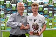 12 July 2015; Pictured is Sean Walsh, Business Marketing Manager for Electric Ireland, proud sponsor of the GAA All-Ireland Minor Championships, presenting Jimmy Hyland, Kildare, with the Player of the Match award for his outstanding performance in the Electric Ireland Leinster Minor Football Championship Final. Throughout the Championship fans can follow the action, support the Minors and be a part of something major through the hashtag #ThisIsMajor. Electric Ireland Leinster GAA Football Minor Championship Final, Longford v Kildare, Croke Park, Dublin. Picture credit: Brendan Moran / SPORTSFILE