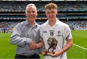12 July 2015; Pictured is Sean Walsh, Business Marketing Manager for Electric Ireland, proud sponsor of the GAA All-Ireland Minor Championships, presenting Jimmy Hyland, Kildare, with the Player of the Match award for his outstanding performance in the Electric Ireland Leinster Minor Football Championship Final. Throughout the Championship fans can follow the action, support the Minors and be a part of something major through the hashtag #ThisIsMajor. Electric Ireland Leinster GAA Football Minor Championship Final, Longford v Kildare, Croke Park, Dublin. Picture credit: Brendan Moran / SPORTSFILE