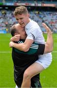 12 July 2015; Ciaran Kelly, Kildare, celebrates with the team's kit manager Jonathan Ferrell after the win. Electric Ireland Leinster GAA Football Minor Championship Final, Longford v Kildare, Croke Park, Dublin. Picture credit: Cody Glenn / SPORTSFILE